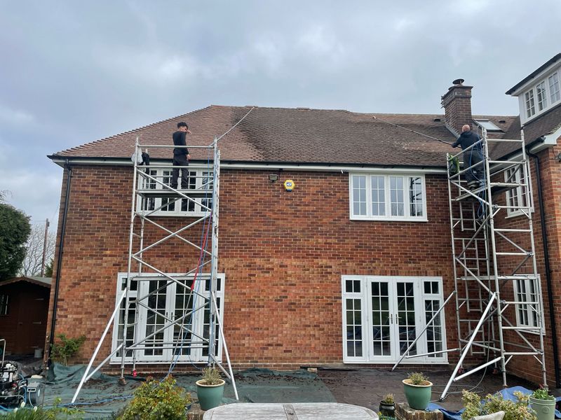 Roof cleaning carried out safely from scaffold towers by The Roof Moss Cleaners in Marlborough